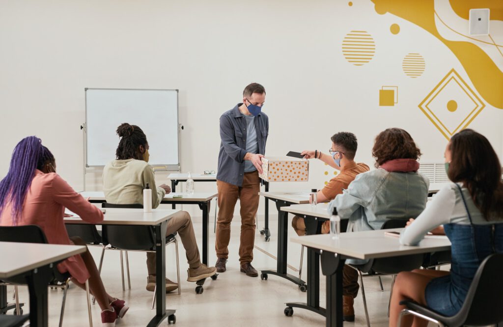 Teacher collecting phones in class